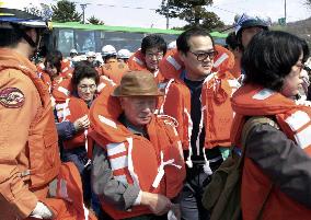Evacuees inspect Lake Toya hot-spring resort